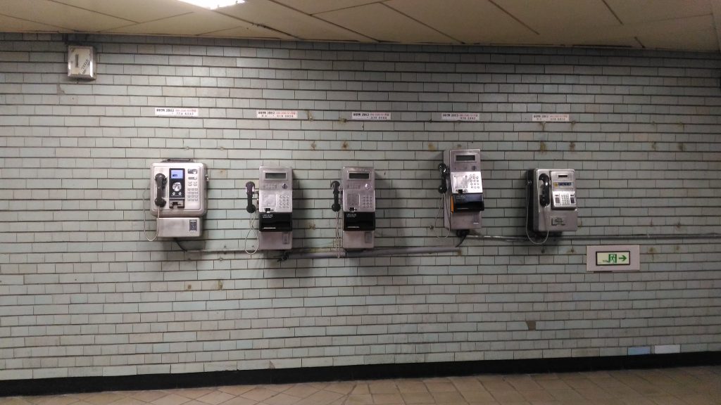 Plain Old Telephones inside a metro station.