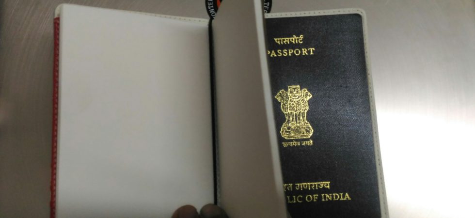 Attaching the notebook to passport holder is easy using an elastic band.