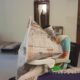 Uma imitates my newspaper reading style.